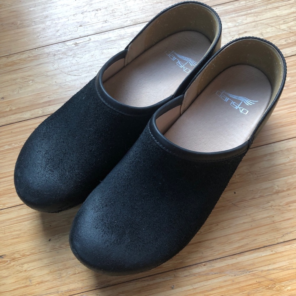 Dansko Brenna Black slip on clogs; Brand new. Never been worn.